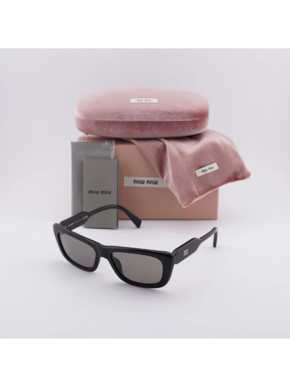 Miu Miu MU B12S 16K80Q Sunglasses Glossy Black Rectangle Frame, Dark Grey Lenses